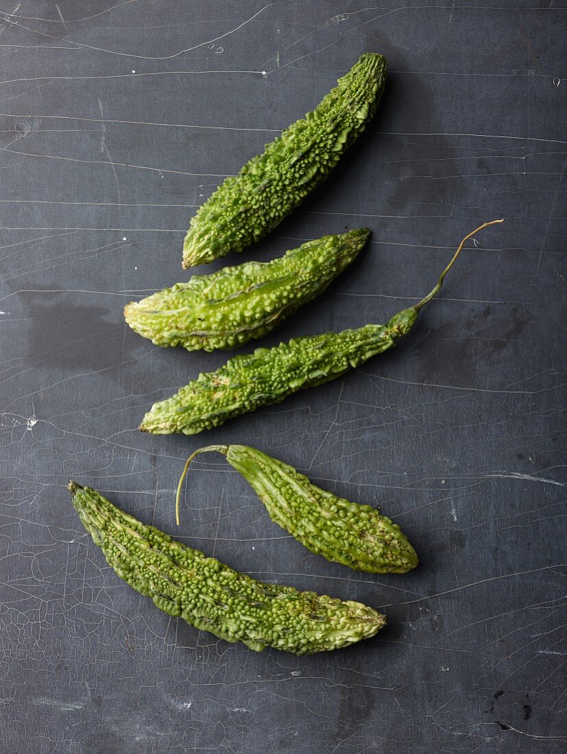 Bitter gourd on a dark surface