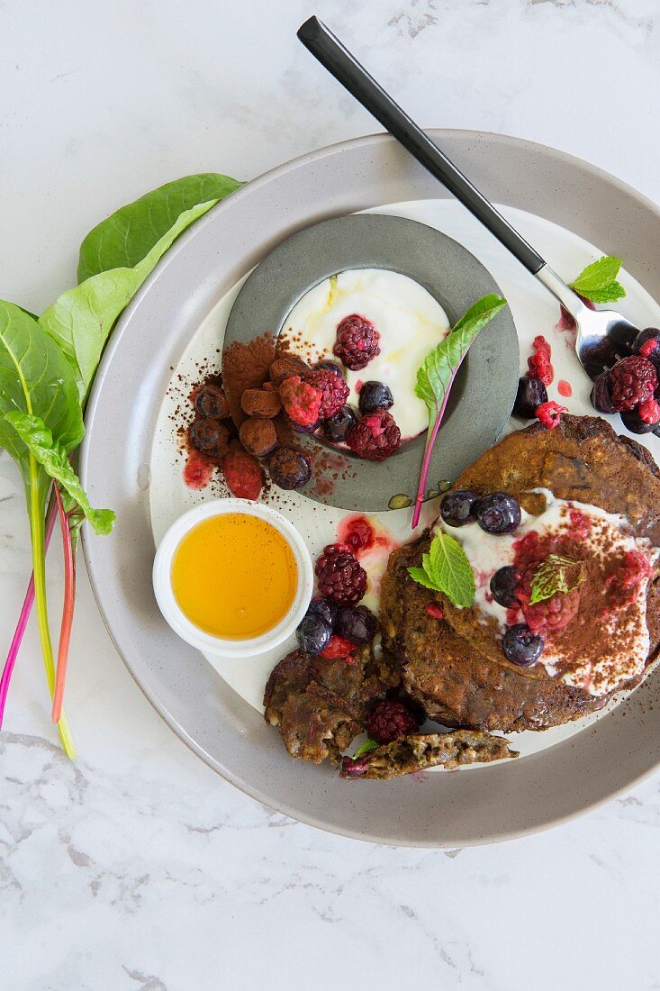 Chocolate pancakes with yoghurt and fresh berries