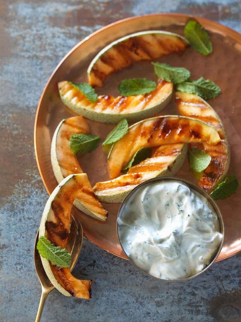 Grilled melon slices with goat's cheese
