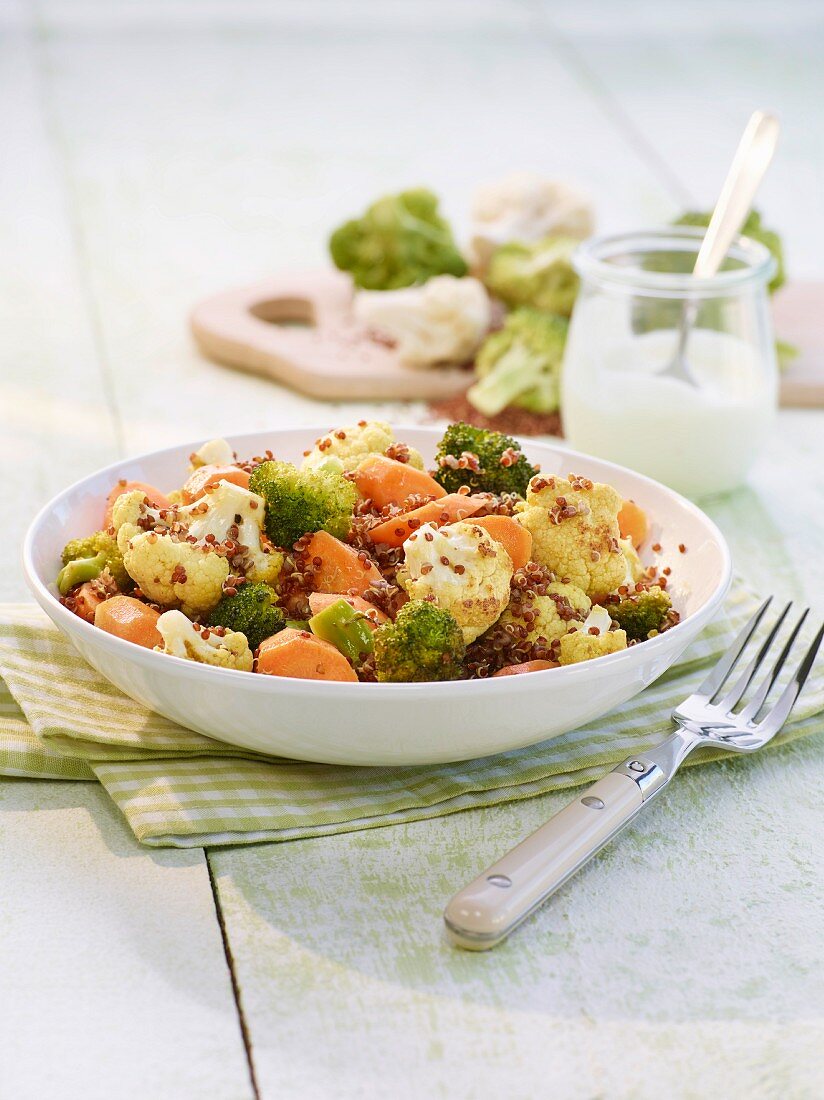 Quinoa salad with cauliflower, broccoli and carrots