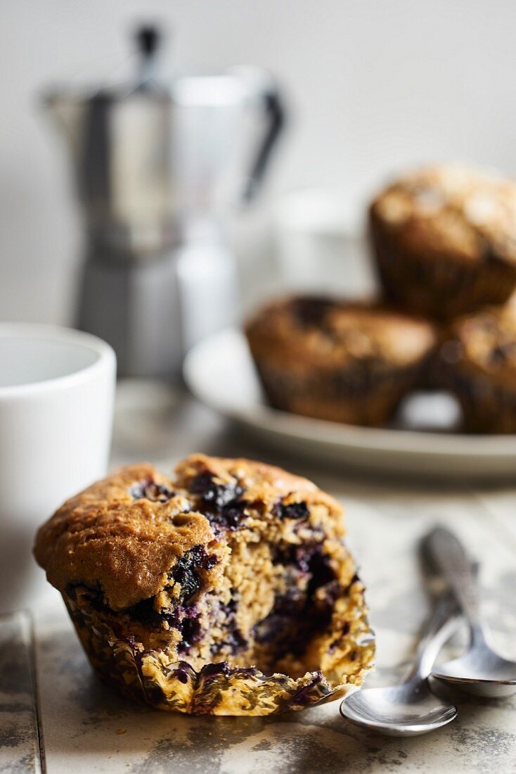 A blueberry muffin with a bite taken out (close up)