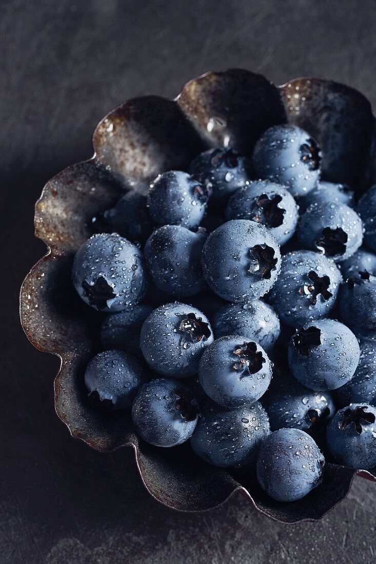Fresh blueberries in a tin plate (close up)