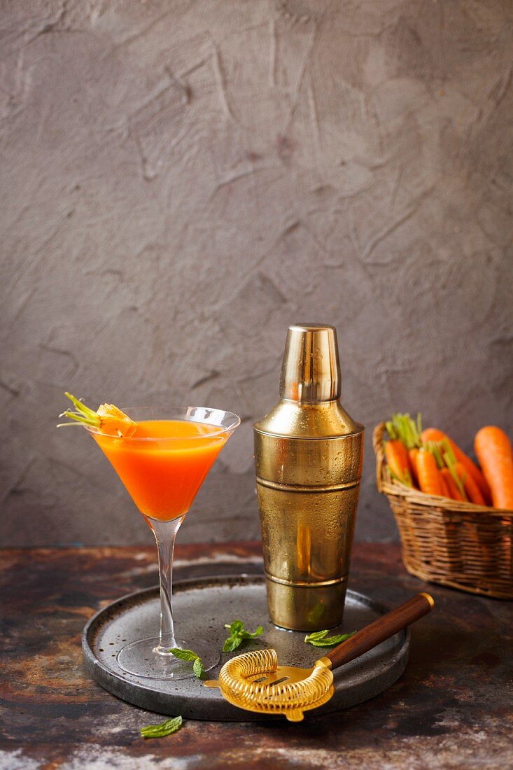A cocktail with carrot juice and gin