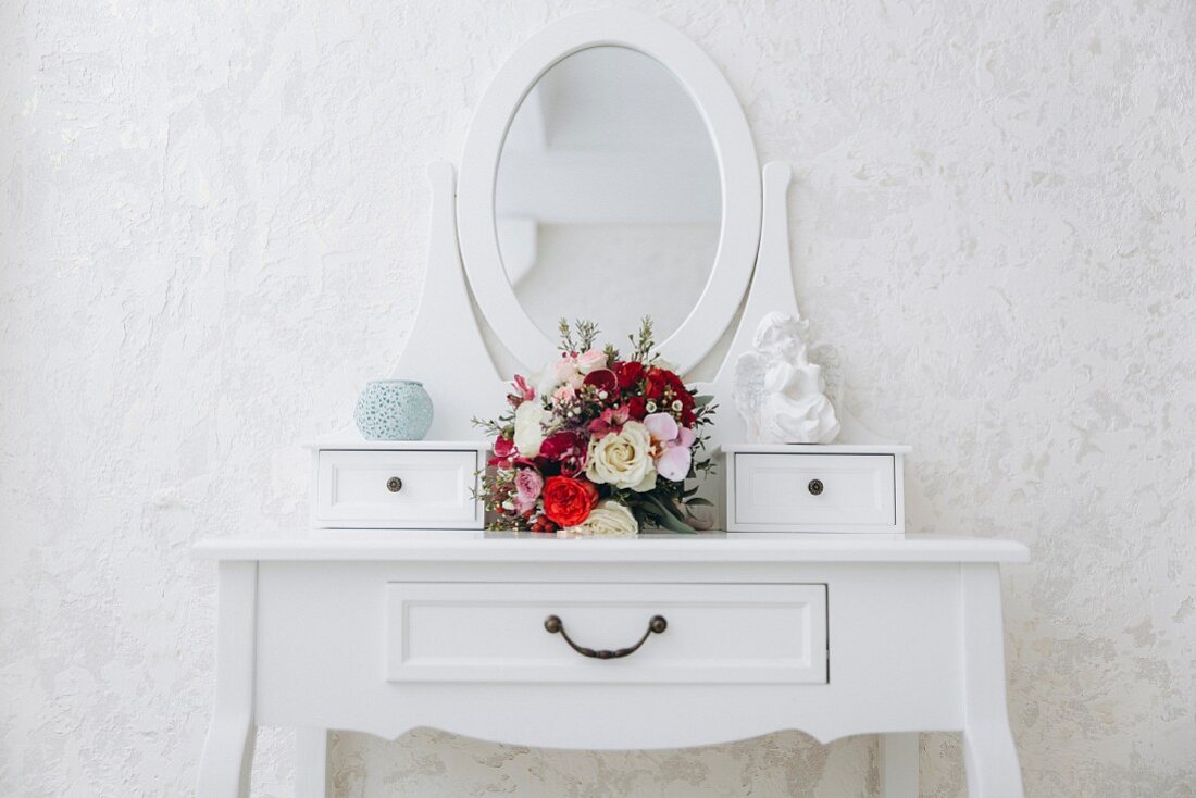 Bouquet of flowers on white dressing table