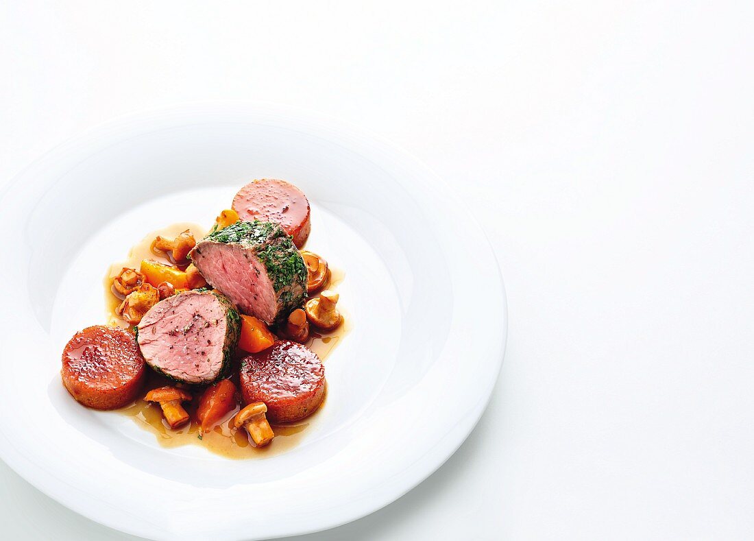 Veal fillet with caramelised tomato polenta, chanterelle mushrooms and apricots