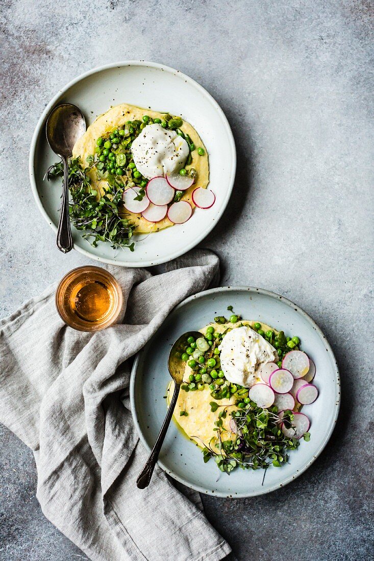 Vegetarian polenta with spring vegetables and burrata (top view)