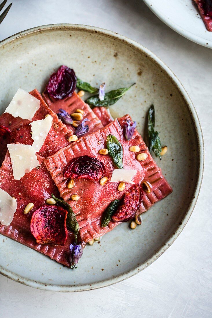 Vegetarian beetroot ravioli with pine nuts and Parmesan