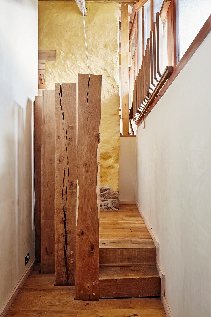 Wooden posts in hallway between building and extension