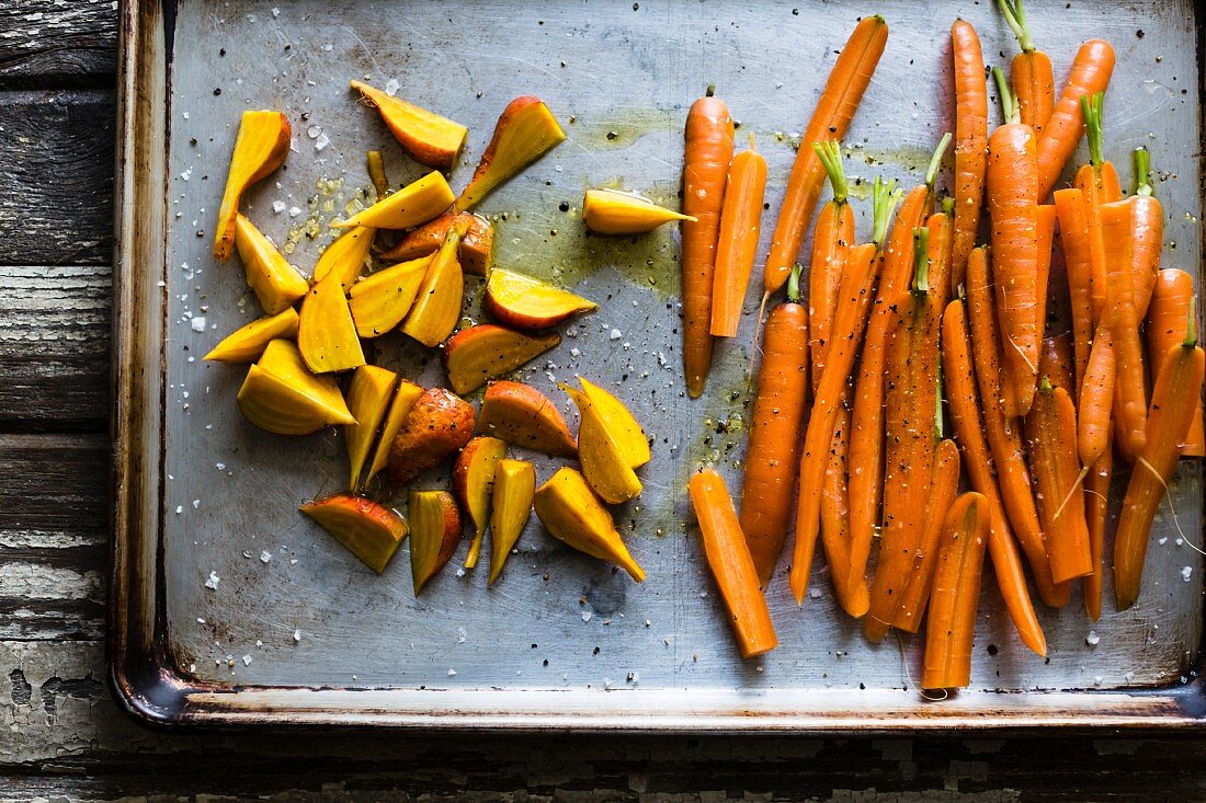 Raw Carrots and beets on a baking sheet