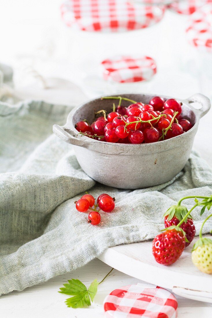Currants and strawberries in a preserving bowl