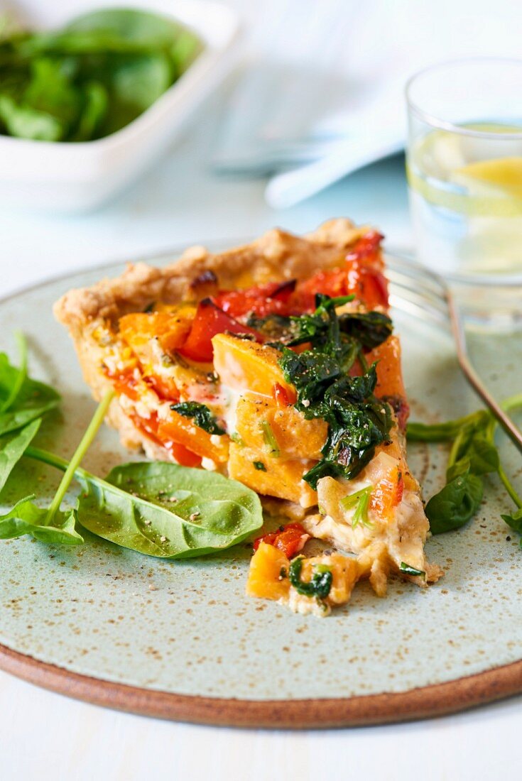 A piece of spinach and sweet potato quiche