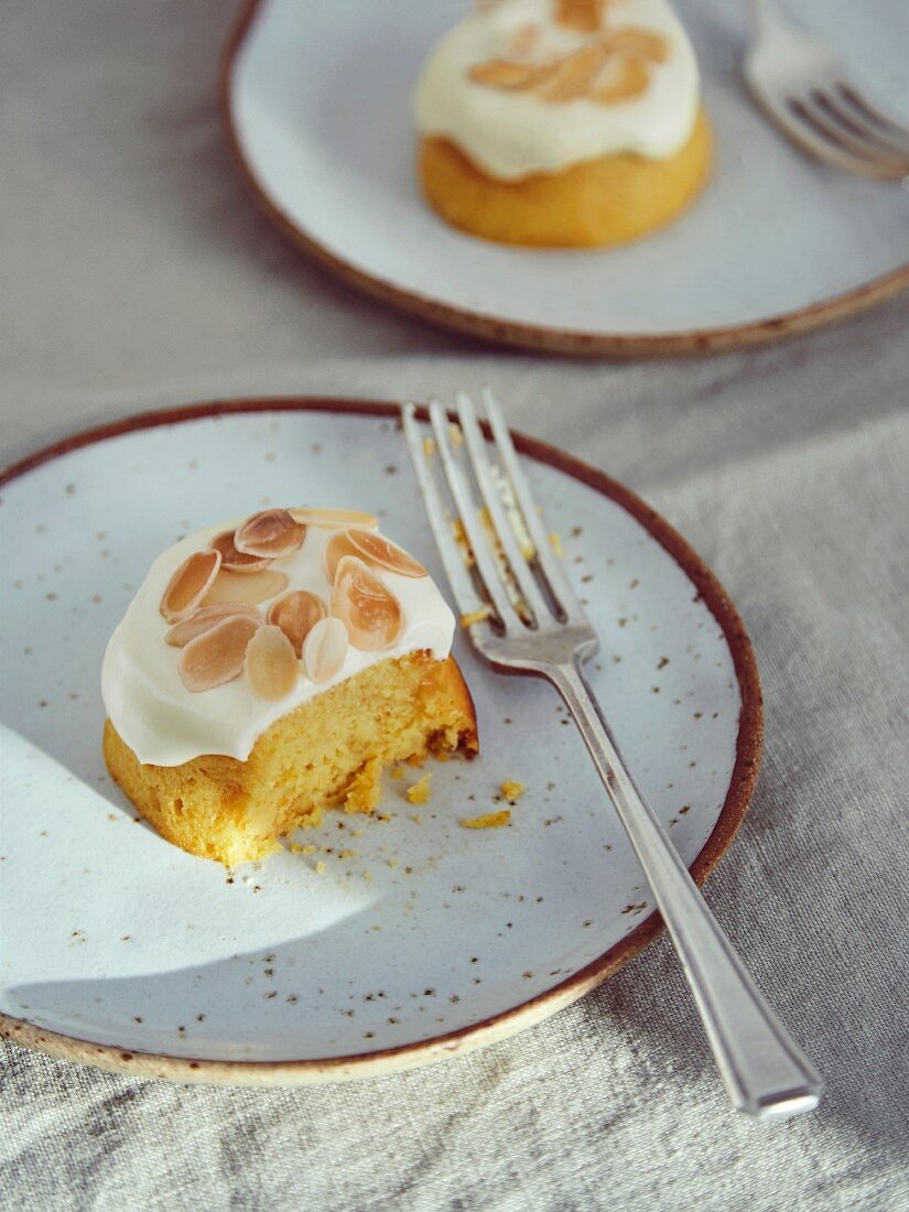 Orange cake with almond flakes, half eaten