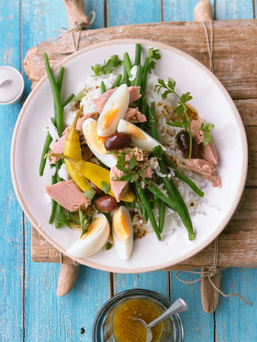 Nicoise salad with tuna, eggs, green beans, and rice