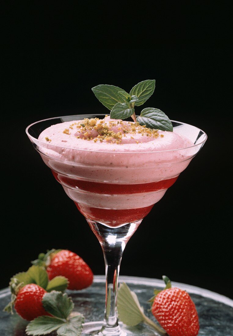 Strawberry mousse with chopped pistachio in dessert shell