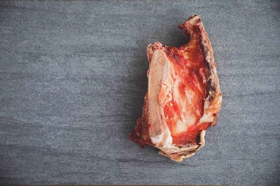 A raw organic meat bone (seen from above)