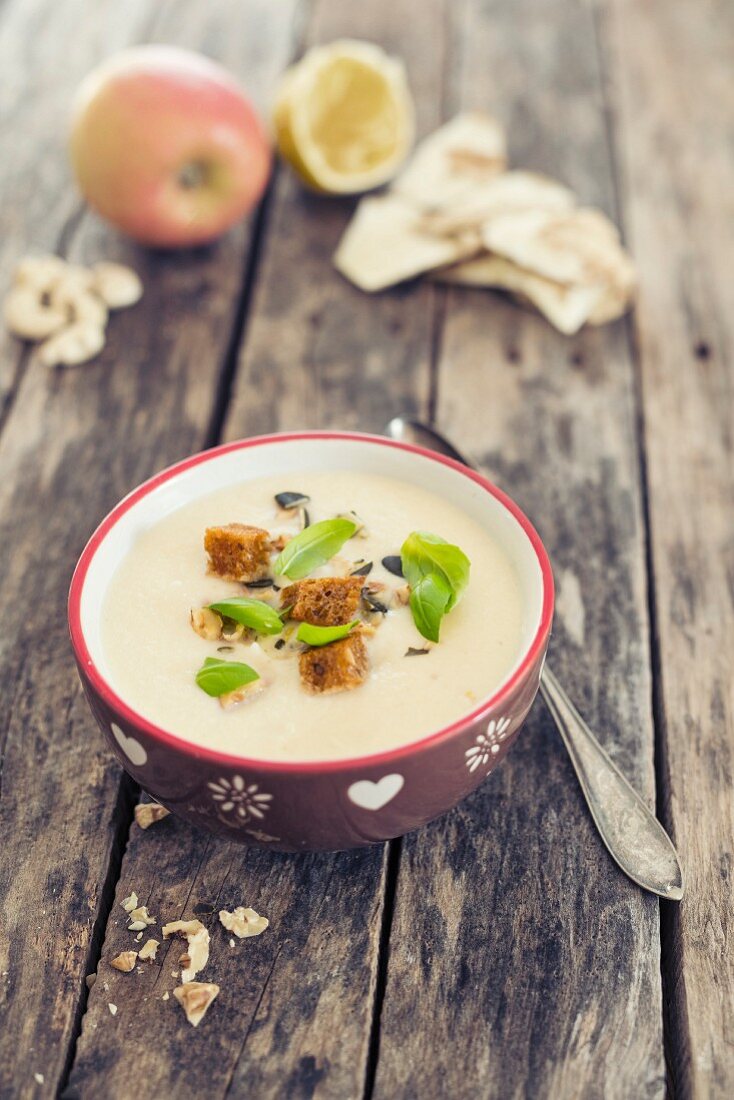 Cream of celery soup with apple and croutons