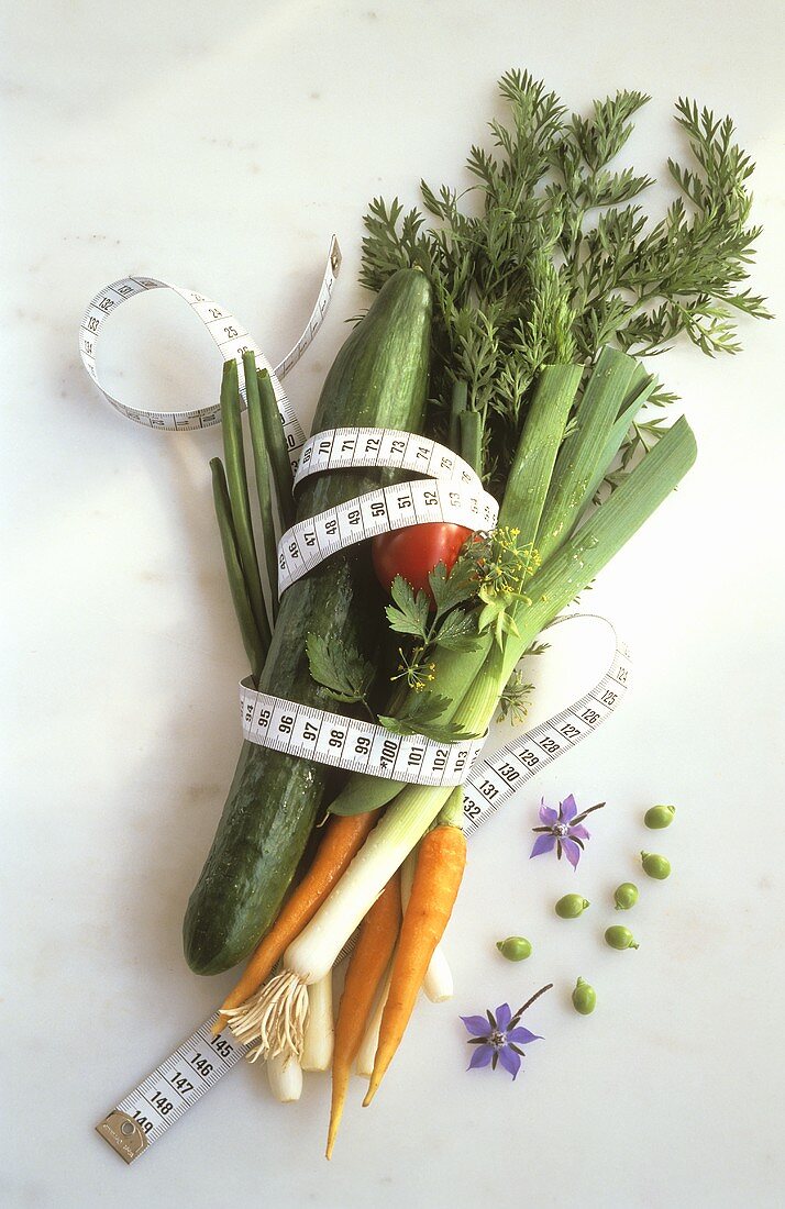 Assorted Vegetables with a Tape Measure Around Them