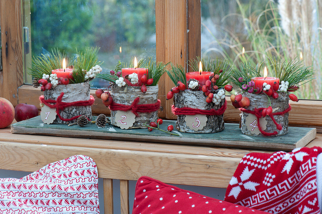 Advent wreath with a difference - red candles in numbered birch pots