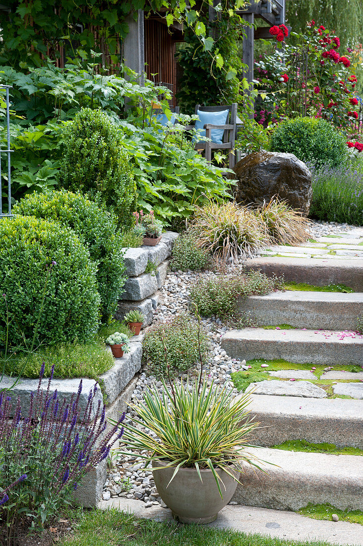 Stairs lead to the covered terrace