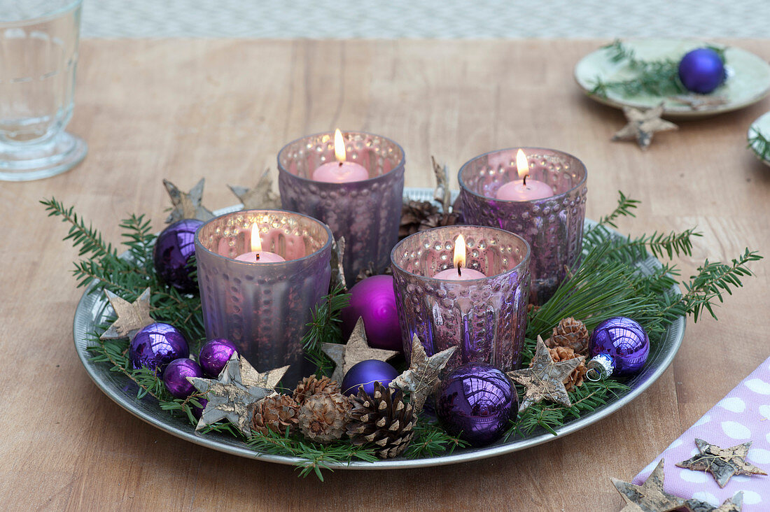 Fast Advent wreath of silver lanterns on a wide bowl