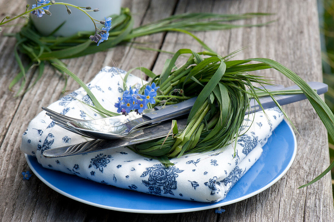 Table decoration with forget-me-nots and salad