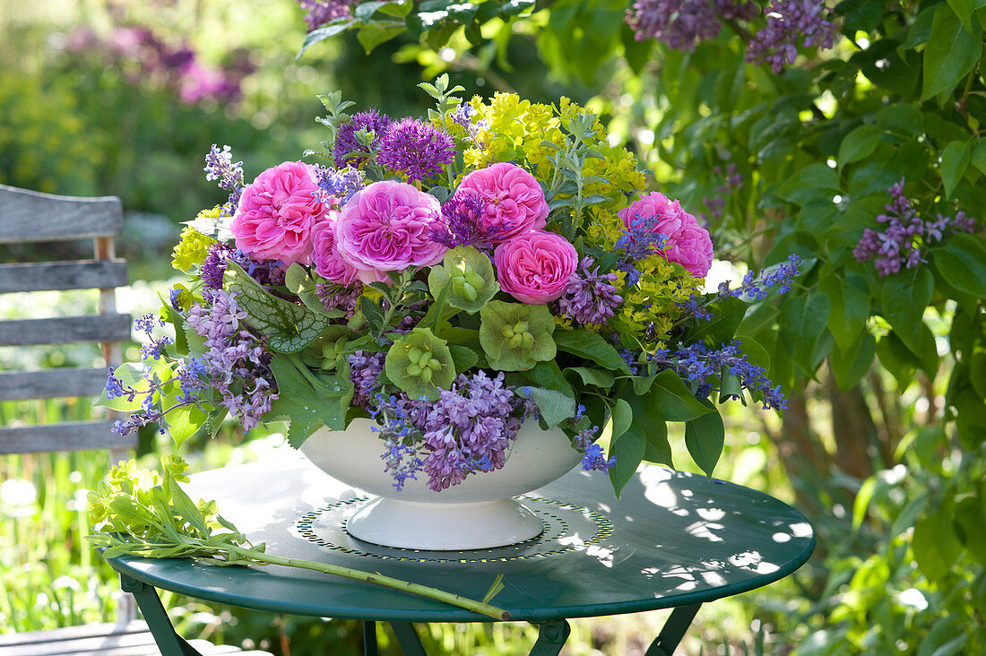 Arrangement of Rose, syringa, euphorbia