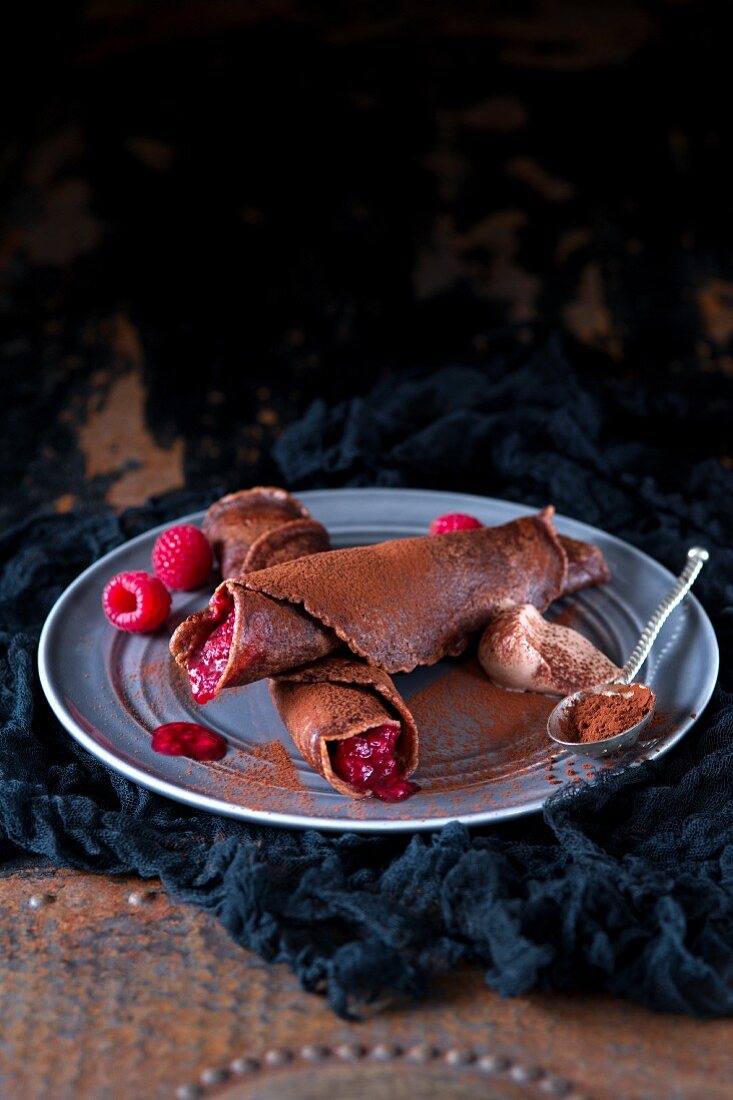Chocolate pancakes with raspberries