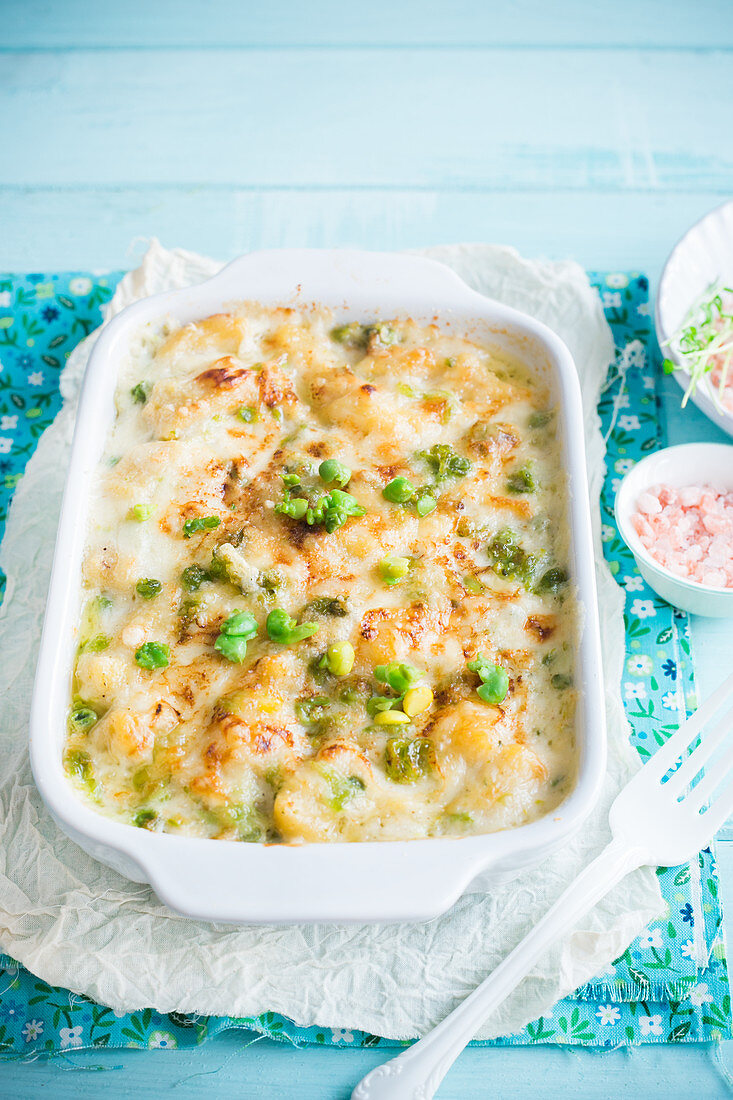 Gnocchi bake with peas, fava beans and béchamel sauce