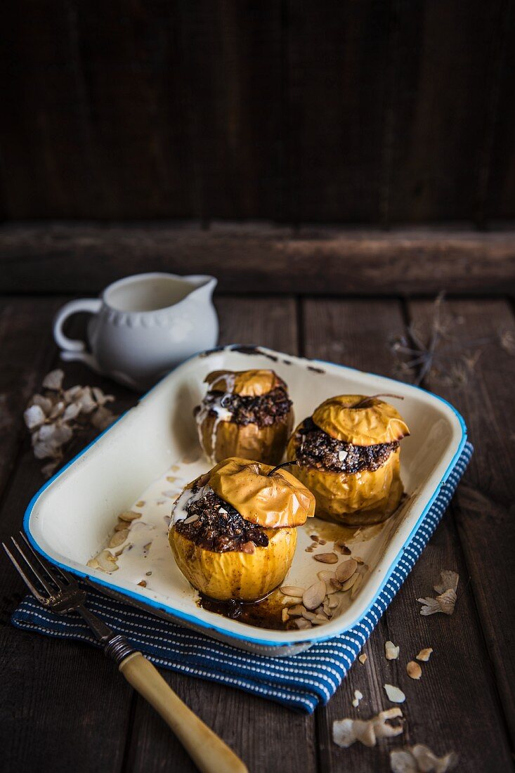 Apples stuffed with dried fruit and almond, baked with cream