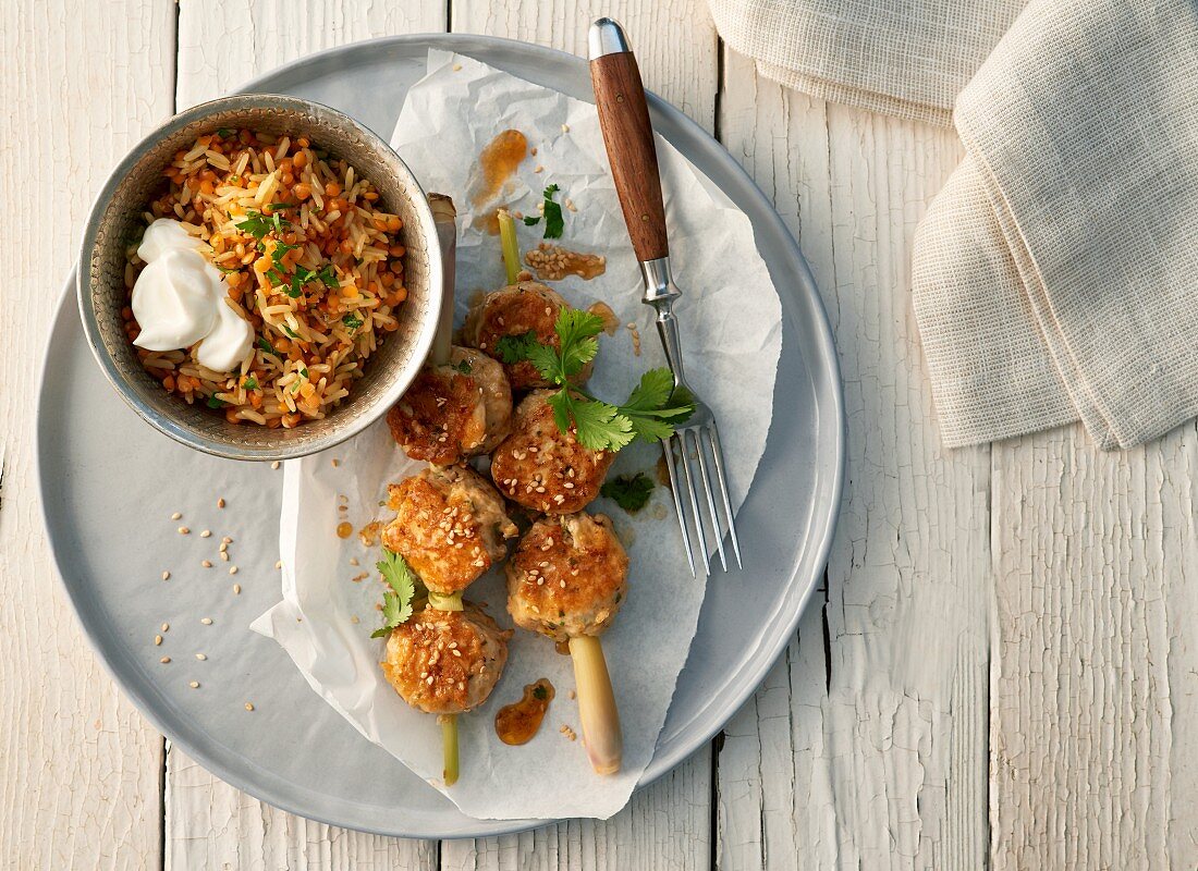 Oriental poultry balls on lemongrass skewers