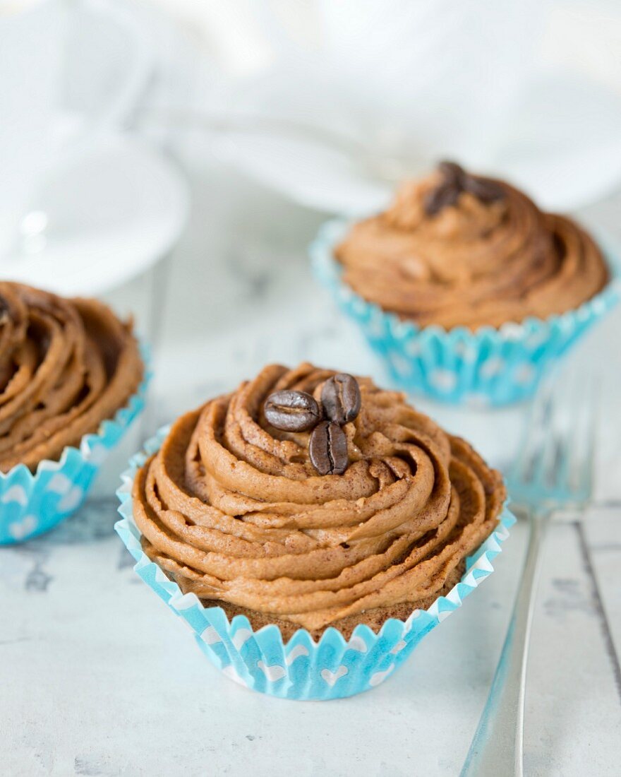 Cupcakes topped with coffee buttercream (close up)