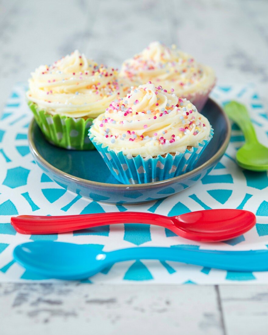 Cupcakes with buttercream and colourful sugar sprinkles