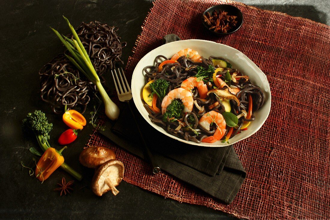 Black noodles with shrimps, chili, mushrooms and vegetables (Asia)