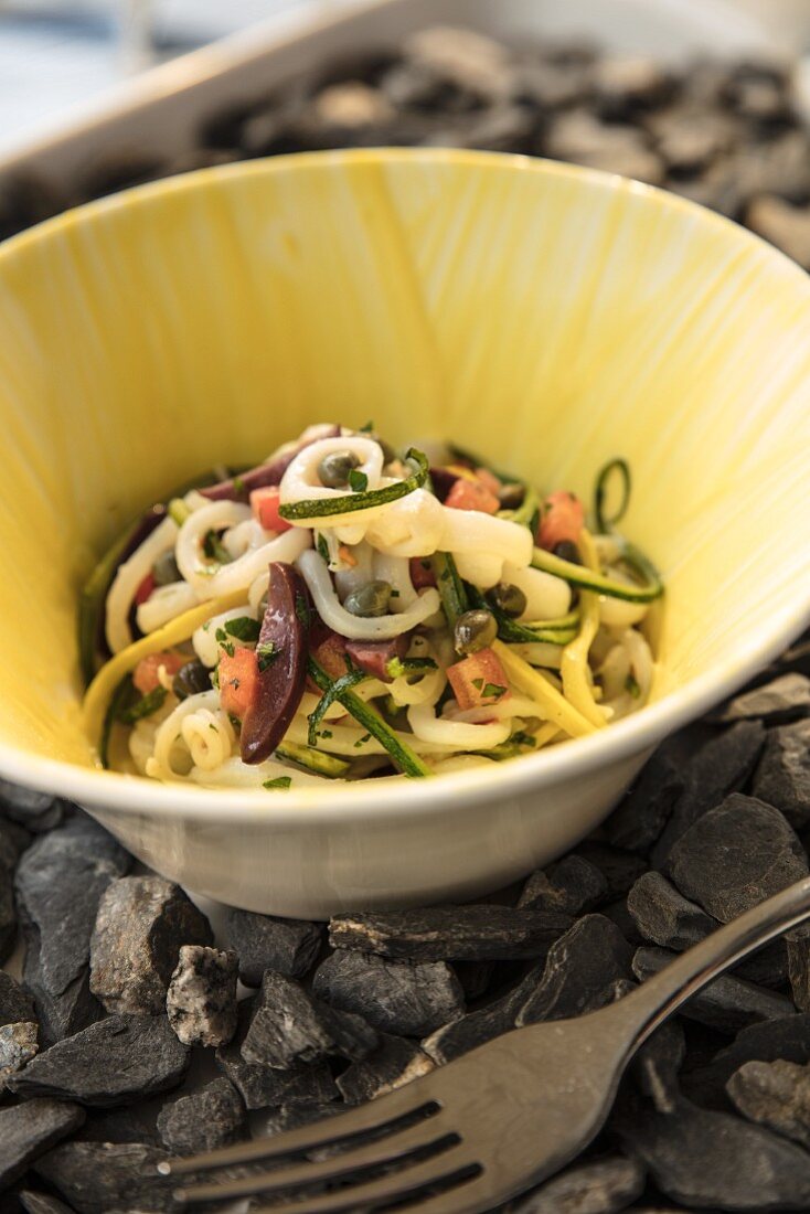 Calamari with Vegetables and Yogurt in deep yellow ceramic bowl