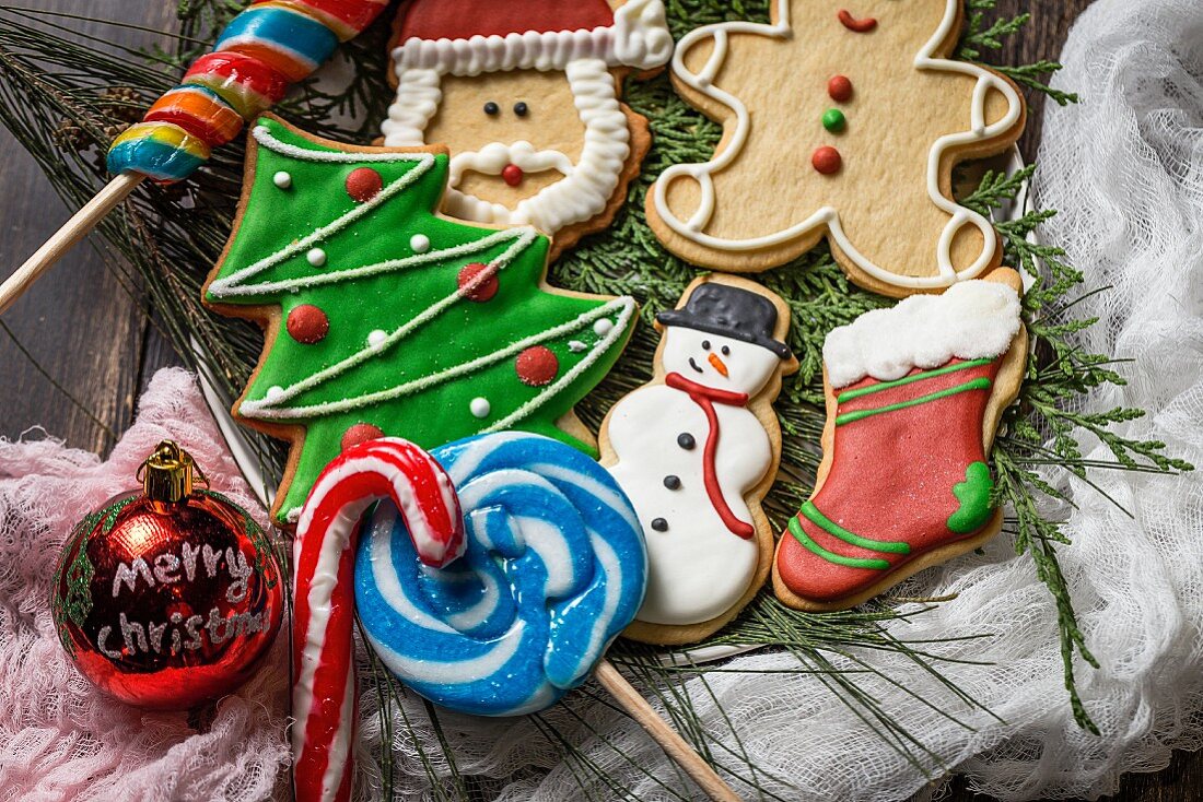 Colourful decorated Christmas biscuits, candy canes and lollipops