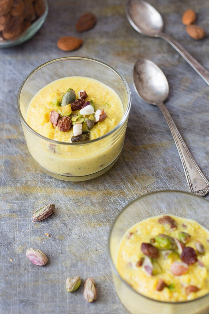 Rice pudding with almonds and pistachios in a glass