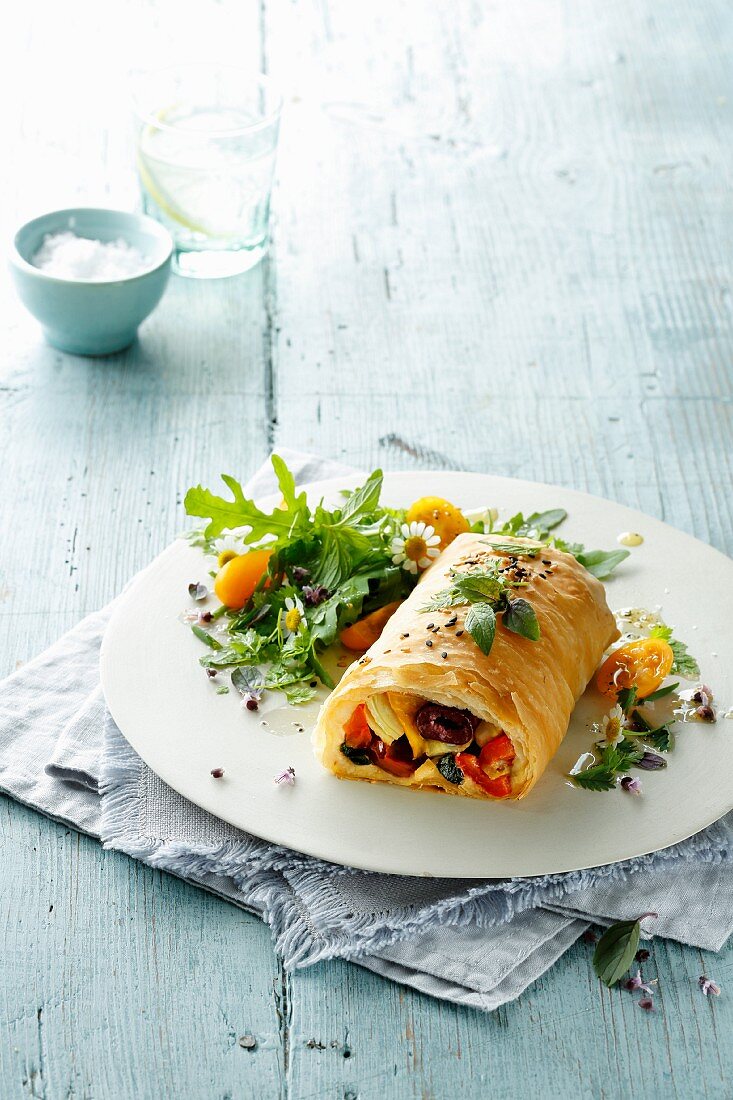 Vegetable strudel with a colorful salad