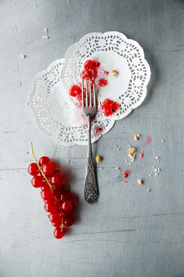 Crushed cranberries on two paper doilies