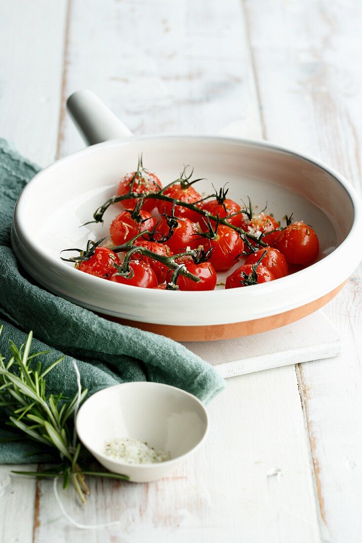 Roasted tomatoes with salt in a baking dish