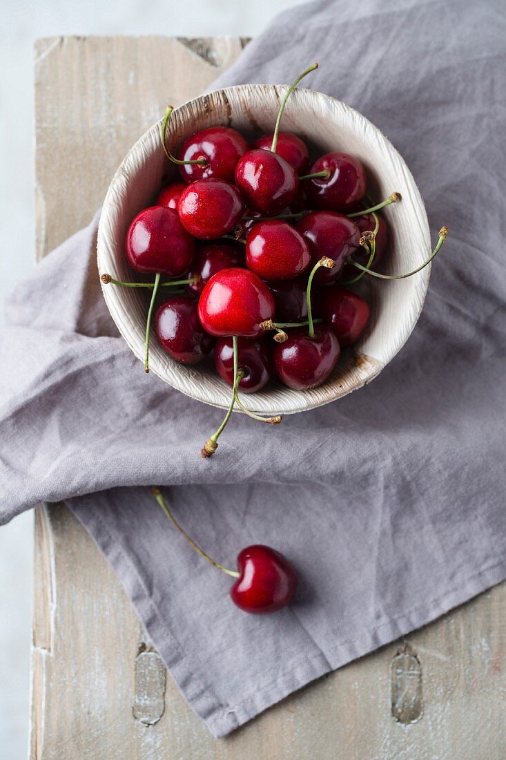 Sweet cherries in a wooden bowl