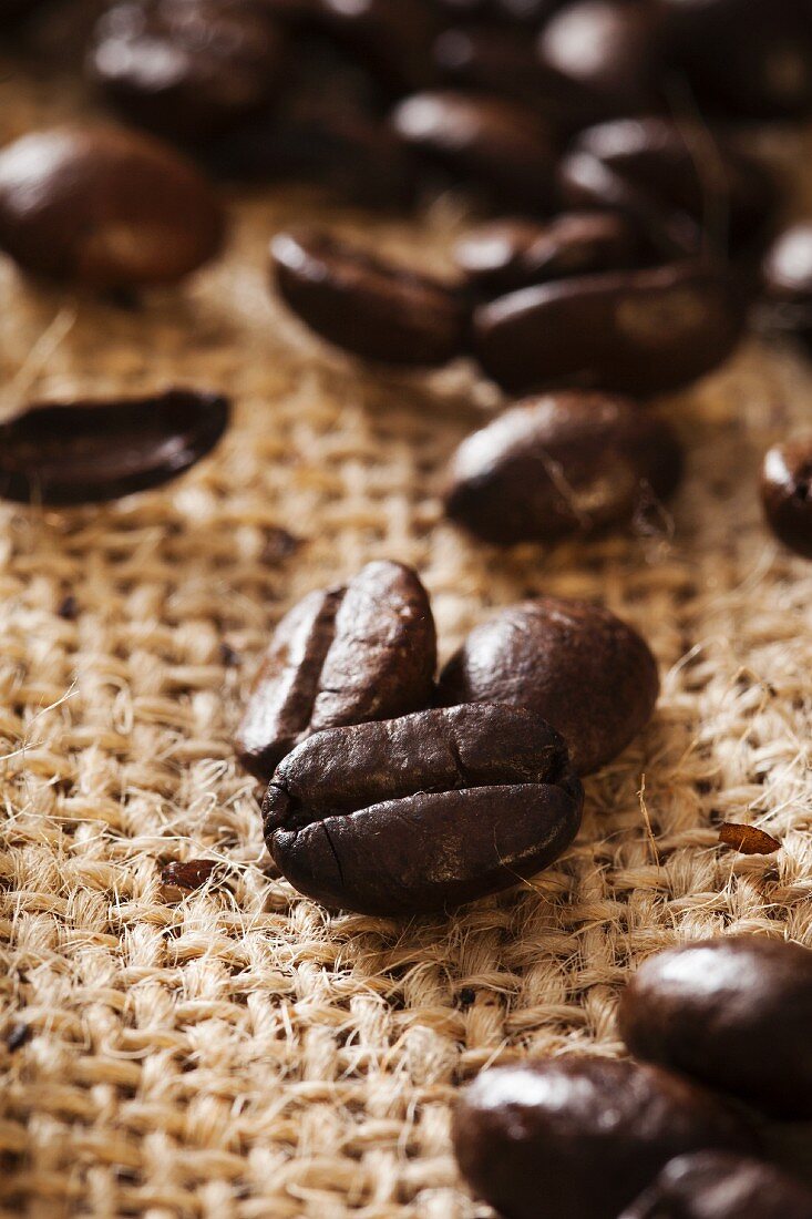 A close-up of coffee beans on a hessian sack