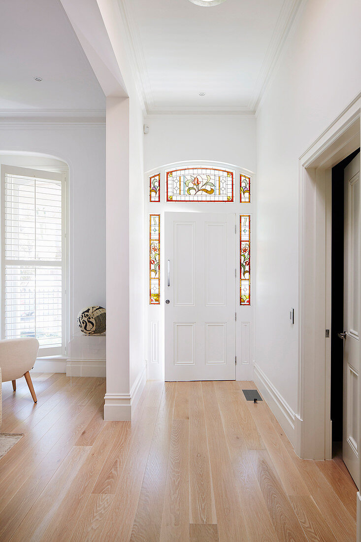 Front door with stained glass frame in a classic old building