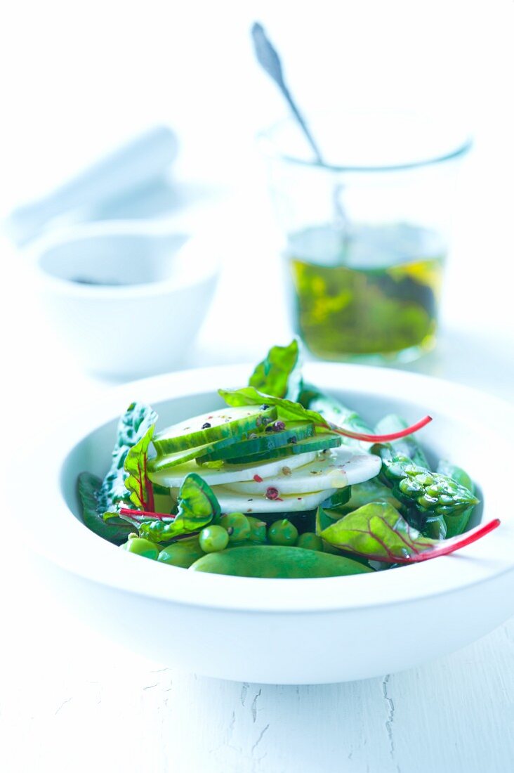 Green vegetable salad with chard, peas, asparagus and cucumber