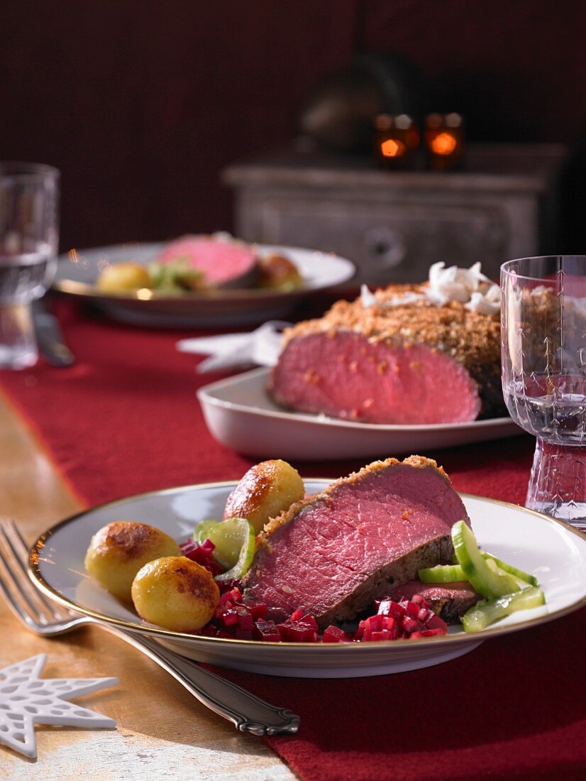 Roast beef with beetroot relish, roast potatoes and cucumber for Christmas
