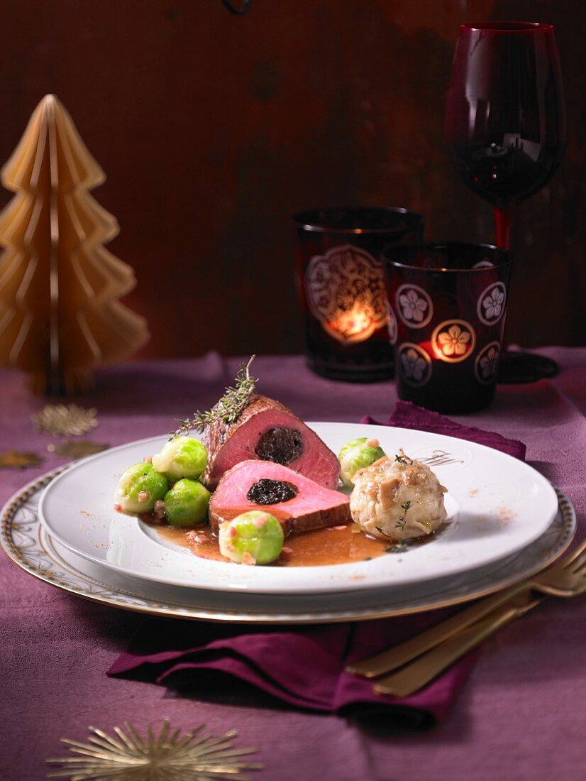 Pink beef fillet with prunes, bread dumplings and brussels sprouts (Christmas)