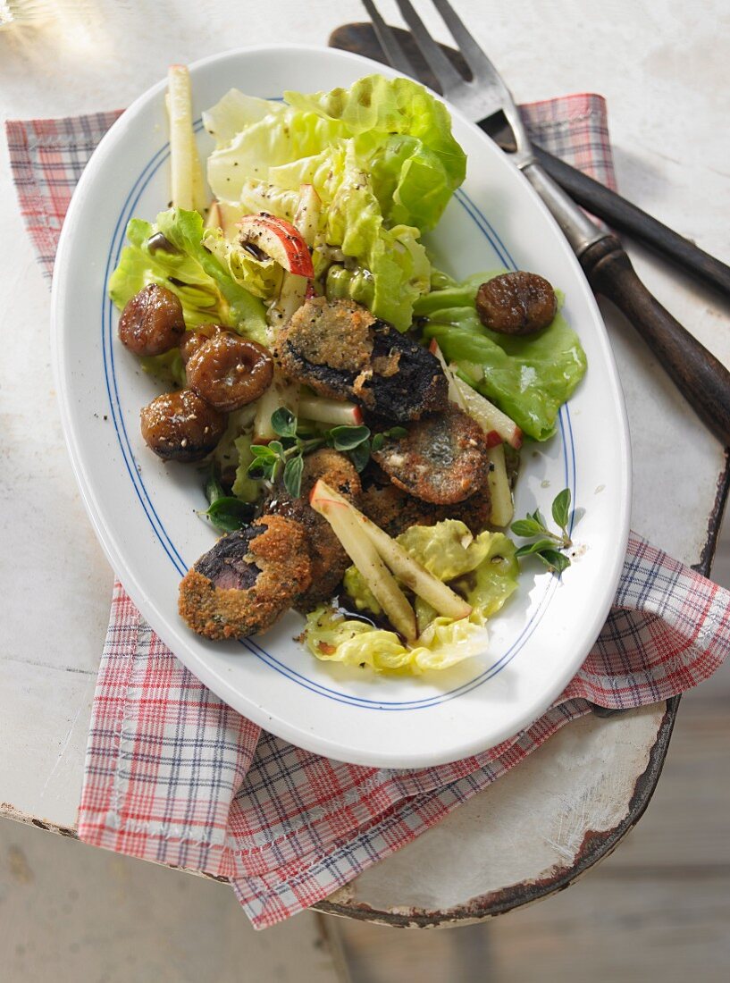 Lettuce with glazed chestnuts and fried sausages (Austria)