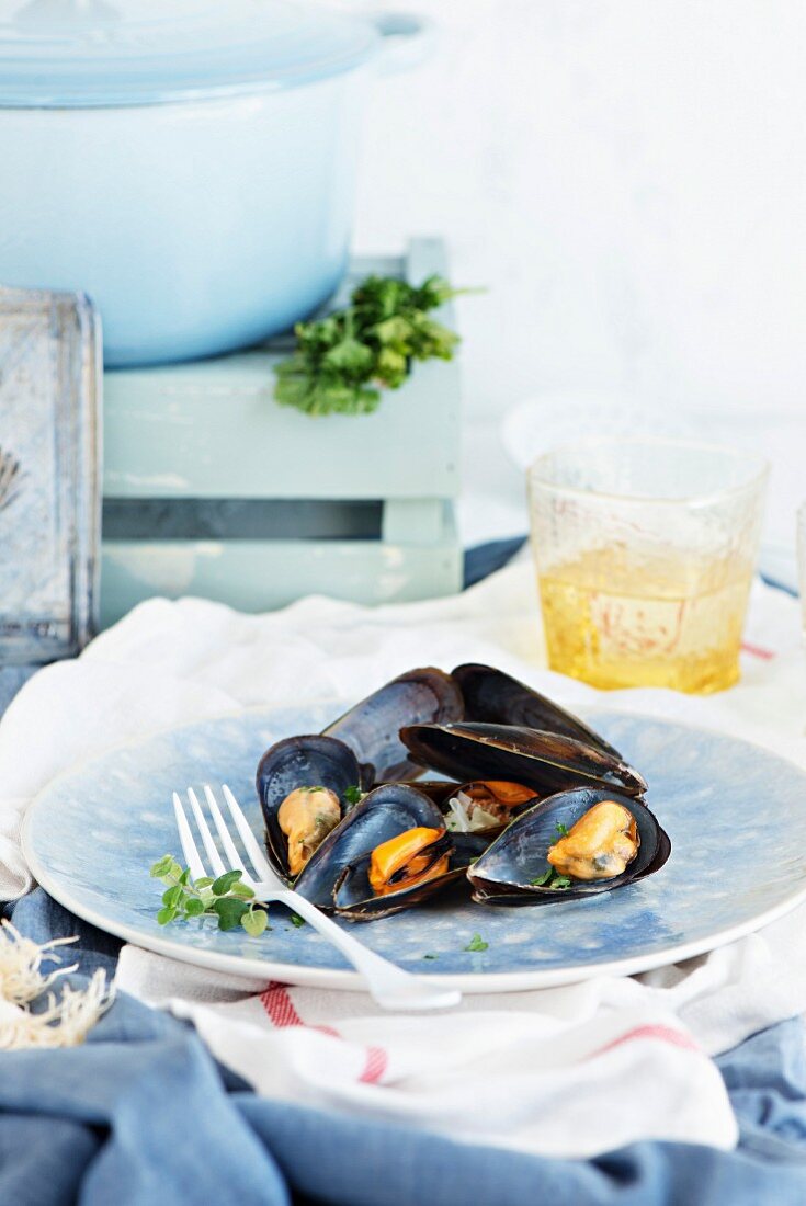 Mussels on a blue plate