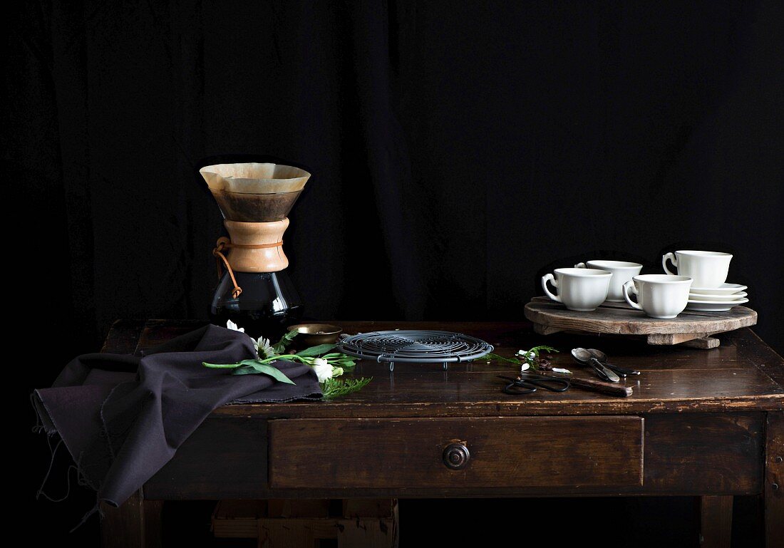 Filter coffee and cups and saucers on a sideboard