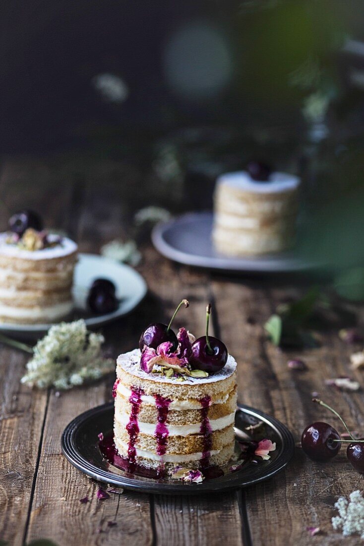Black cherry cake on wooden table