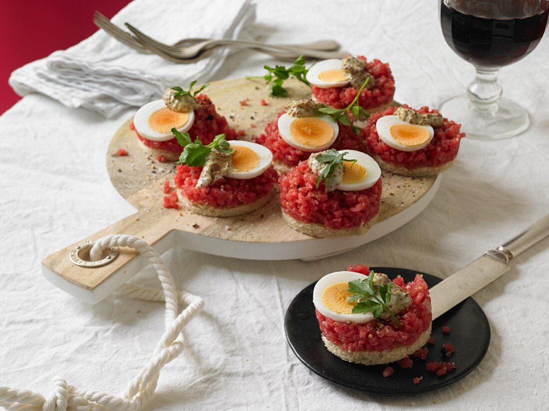 Beef tartar with boiled eggs and a mustard dip